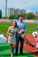 Фоторепортаж: Андрій Більда та Марина Волошенко одружилися на біговій доріжці стадіону